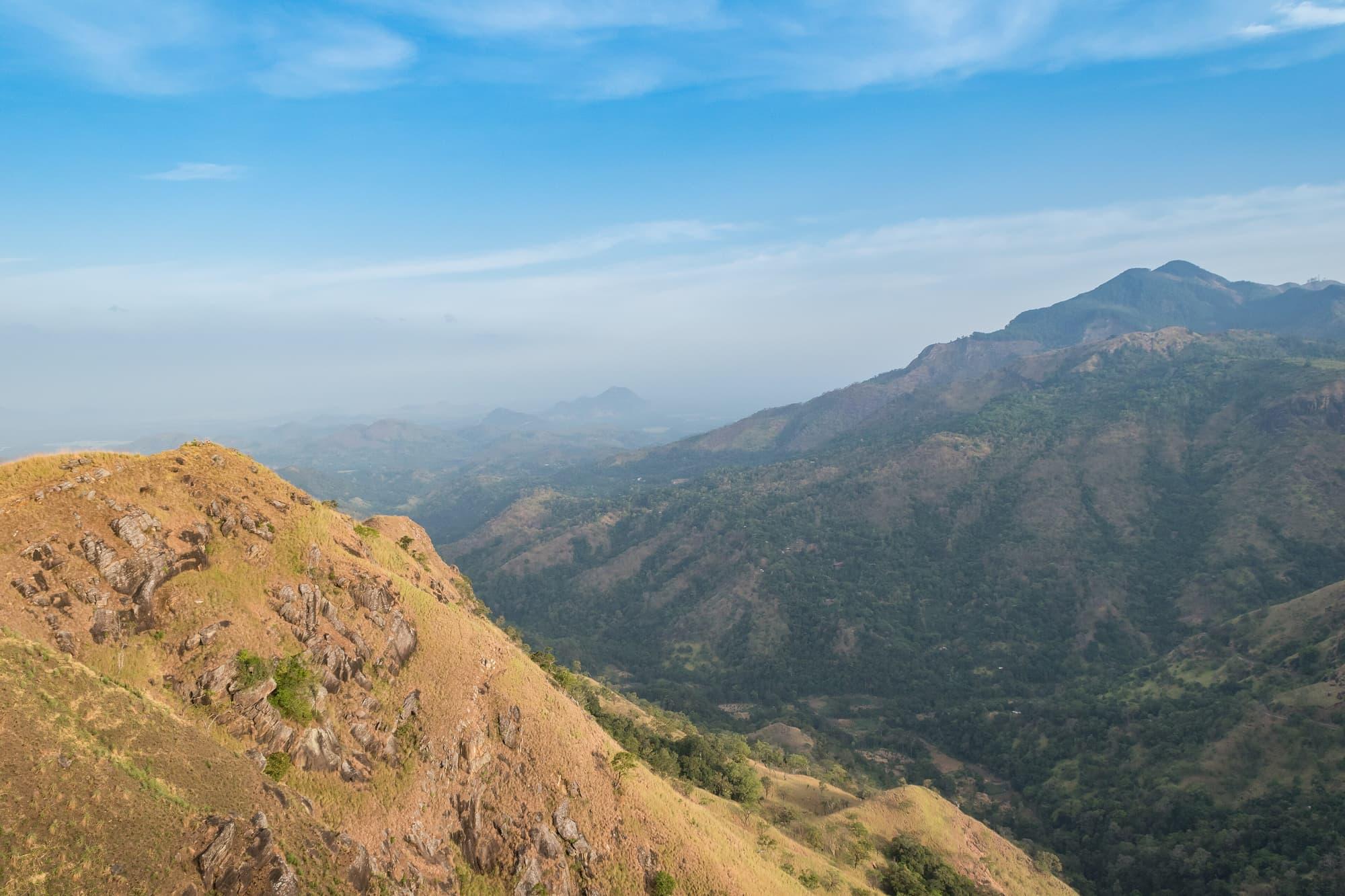 The ridge of Little Adam's Peak lit gold, the hill country rolling away behind